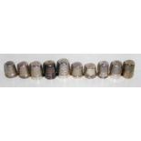 A COLLECTION OF SIX VINTAGE SILVER THIMBLES Having engine turned decoration and one set with