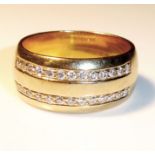 AN 18CT GOLD AND DIAMOND RING Having two rows of 13 round cut diamonds (size P).