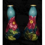 DOULTON LAMBETH, A PAIR OF 'IMPASTO WARE' POTTERY VASES Everted rim over a shaped body with floral