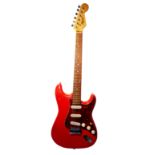 A FENDER SQUIRE STRATOCASTER GUITAR Cherry red finish, burgundy scratch plate, and rosewood
