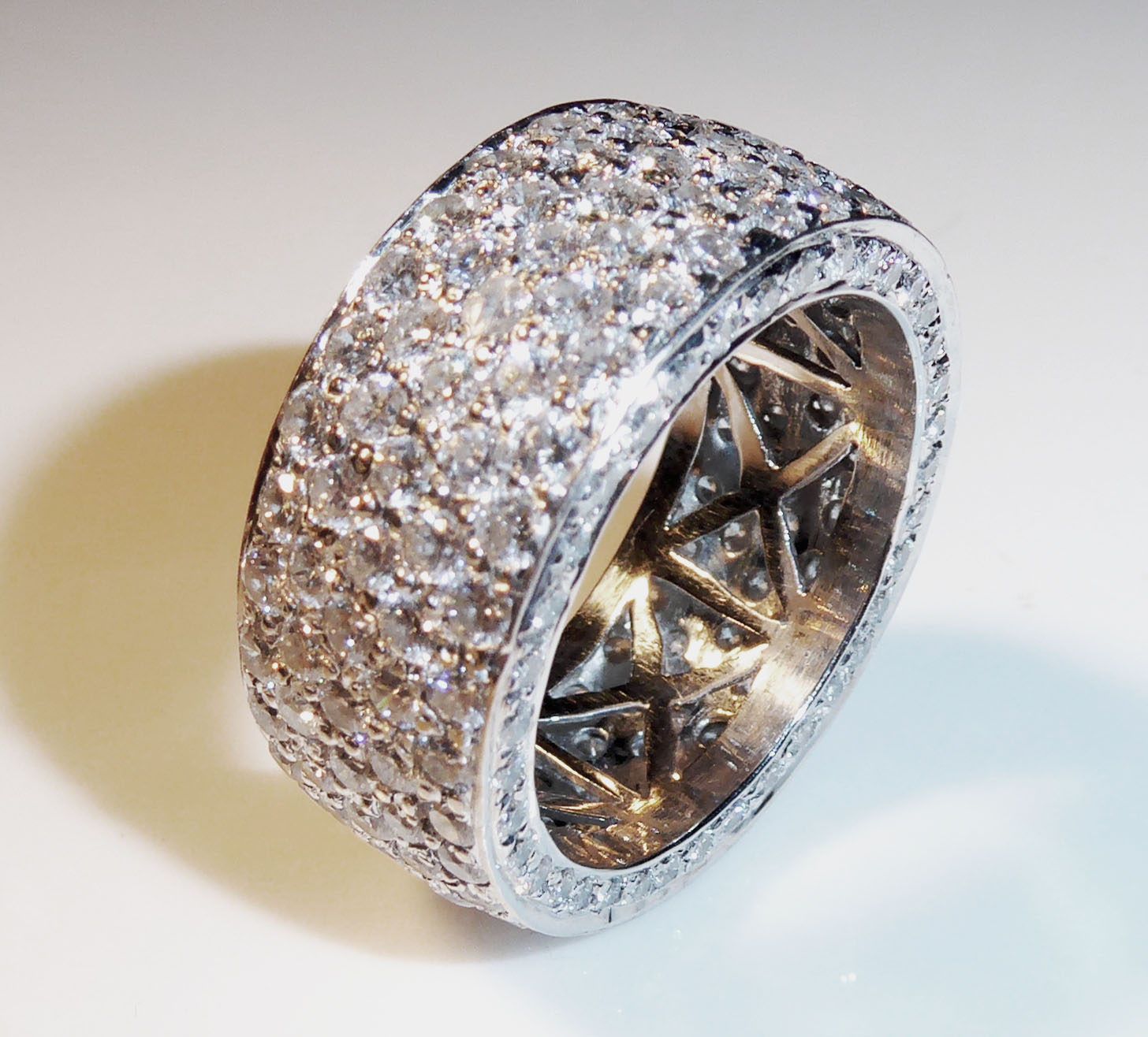 AN 18CT WHITE GOLD AND DIAMOND PAVÈ SET RING With approximately 150 round cut diamond in a pavè