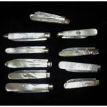 TEN GEORGIAN AND LATER SILVER FRUIT KNIVES All having mother of pearl handles with inlaid