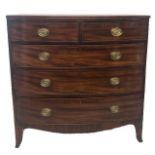 AN EARLY VICTORIAN MAHOGANY BOW FRONT CHEST Of two short above three long drawers, fitted with brass