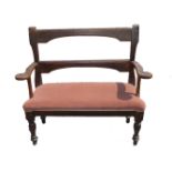 A 20TH CENTURY OAK TWO SEATER BENCH Peg construction with shaped arms and fitted velvet cushion