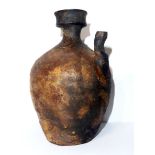 A CHINESE BLACK GLAZE POTTERY AMPHORA BALUSTER JUG With wide circular rim and single spout. (