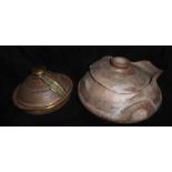 TWO TERRACOTTA COOKING POTS A spherical pot with twin handles and lozenge form lid and a brass and