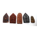 A COLLECTION OF FIVE ORIENTAL MINIATURE TERRACOTTA CARVINGS Featuring a seated Buddha within an