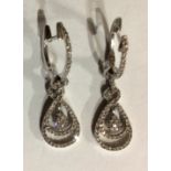 A PAIR OF 14CT GOLD AND DIAMOND EARRINGS Pavé set diamonds forming consecutive pear form