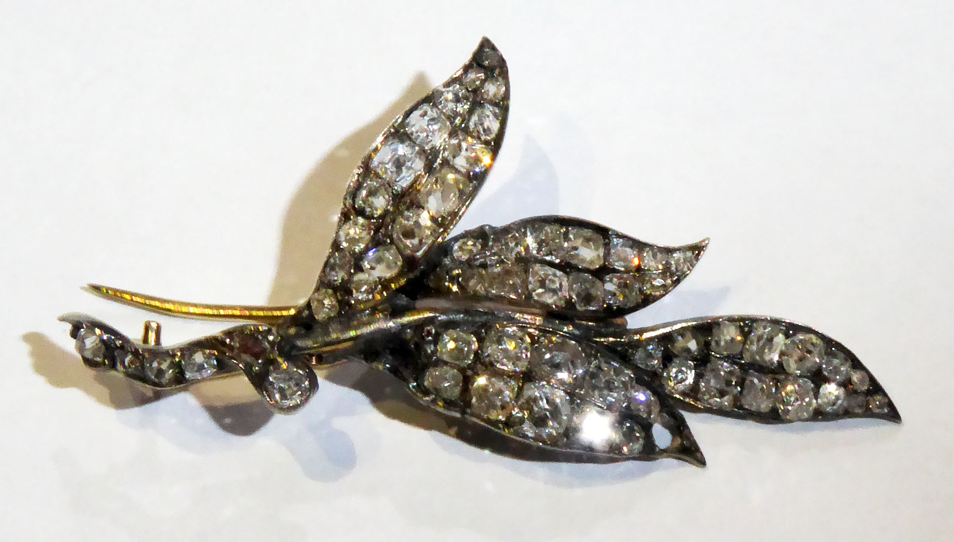 A 19TH CENTURY DIAMOND BROOCH OF FOLIATE DESIGN Set throughout with old, mixed and cushion cut