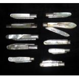 TEN GEORGIAN AND LATER SILVER FRUIT KNIVES With hallmarked folding blades and mother of pearl