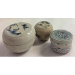 TWO 16TH CENTURY CHINESE MING DYNASTY PORCELAIN CYLINDRICAL JARS AND COVERS One painted with blue