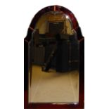 AN ART DECO BEVELLED EDGE MIRROR With cranberry glass edge and shaped top, together with a