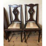 A PAIR OF VICTORIAN OAK SIDE CHAIR With pierced vase splat backs and upholstered pad seats.