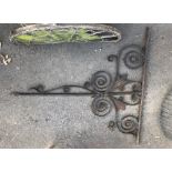 A LARGE 18TH CENTURY WROUGHT IRON WALL MOUNTING BRACKET The scroll work of organic form. (185cm x