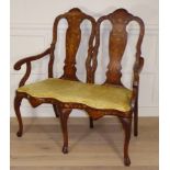A 19TH CENTURY DUTCH WALNUT CHAIR SETTEE With floral marquetry inlay and upholstered seat, raised on