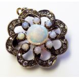 A VICTORIAN 15CT GOLD, OPAL AND DIAMOND FLORAL FORM PENDANT The central opals surrounded by