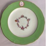 AN 18TH CENTURY ENGLISH PORCELAIN CABINET PLATE Having a wide green border and a family crest '3 LC'