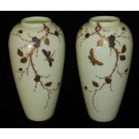 A PAIR OF VICTORIAN OPALINE GLASS VASES Decorated with butterflies and foliage. (h 27cm)
