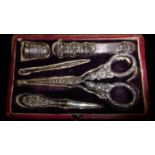 WITHDRAWN A CASED 19TH CENTURY CONTINENTAL SILVER ETUI SET WITHDRAWN Comprising a pair of