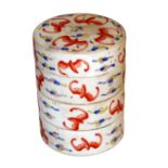 A CHINESE FAMILLE ROSE CYLINDRICAL PORCELAIN STACKING BOX With four layers hand painted with bats.