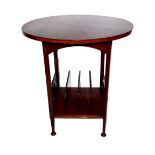 A 20TH CENTURY MAHOGANY OCCASIONAL TABLE The circular top with cross banded edge over a Canterbury