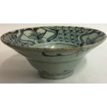 A CHINESE MING DYNASTY POTTERY BOWL Having a flared rim and hand painted with flowers and