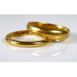 TWO VINTAGE 22CT GOLD WEDDING BANDS Of plain form (size N).