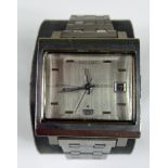SEIKO, A VINTAGE STAINLESS STEEL GENT'S WRISTWATCH Having a rectangular silver tone dial with day