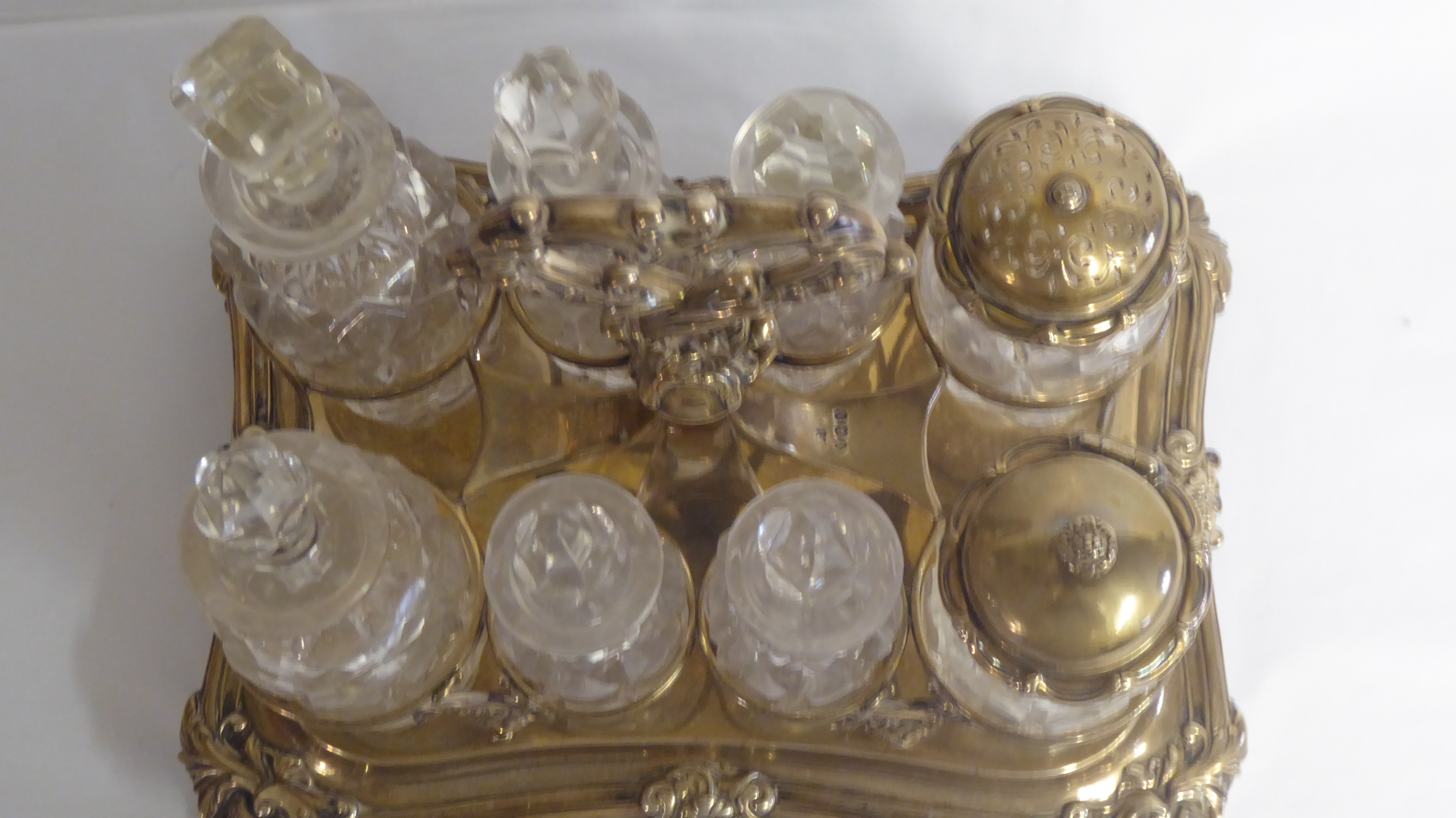 A WILLIAM IV SILVER EIGHT PIECE CONDIMENT SET With scrolling handle over crystal glass condiments, - Image 2 of 2