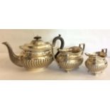 AN EARLY 20TH CENTURY SILVER MATCHED THREE PIECE BACHELOR'S TEA SERVICE Comprising a teapot, sugar