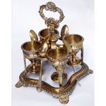 A 19TH CENTURY SILVER FOUR PIECE EGG CRUET SET The handle having 'C' scroll and shell motifs over