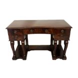 AN EARLY 19TH CENTURY MAHOGANY CONCAVE FRONT SIDE/DRESSING TABLE Fitted with five drawers and raised