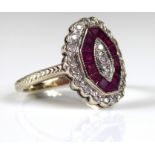 AN ART DECO 18CT GOLD, RUBY AND DIAMOND RING Set with a single row of diamonds edged by rubies