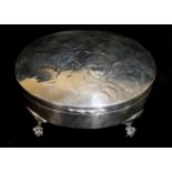 WILLIAM COMYNS, AN EDWARDIAN SILVER DRESSING OVAL TABLE BOX With embossed decoration of winged