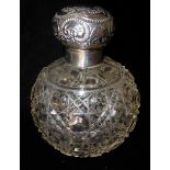 A VICTORIAN SILVER AND HOBNAIL CUT GLASS SCENT BOTTLE Having an embossed spherical screw cap. (