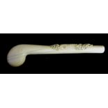 A 19TH CENTURY IVORY WALKING CANE HANDLE Finely carved with a floral and scrolled cartouche and