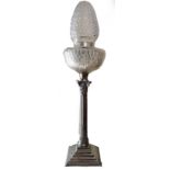 A 20TH CENTURY WHITE METAL TABLE LAMP With cut glass shades over a reeded and fluted column,