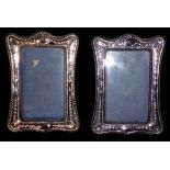 A PAIR OF 20TH CENTURY SILVER RECTANGULAR EASLE PHOTOGRAPH FRAMES With embossed decoration,