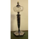 AN EARLY 20TH CENTURY SILVER PLATED OIL LAMP With engraved clear glass bowl (converted to