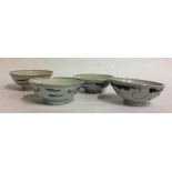 A COLLECTION OF FOUR CHINESE KANGXI DYNASTY PORCELAIN BOWLS Hand painted with stylized dragons. (