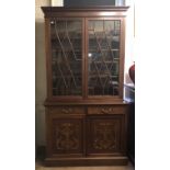 H. MAWER & STEPHENSON, A LATE 19TH CENTURY MAHOGANY AND FINE MARQUETRY INLAID BOOKCASE The two