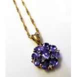 A 9CT GOLD, DIAMOND AND GEM SET DAISY CLUSTER PENDANT AND NECKLACE Set with an arrangement of blue