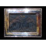 AN EDWARDIAN RECTANGULAR SILVER EASLE PHOTOGRAPH FRAME With beaded edge, hallmarked Birmingham,