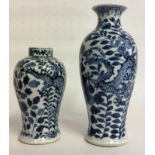 TWO 19TH CENTURY CHINESE PORCELAIN VASES Hand painted with stylized dragons amongst foliage, bearing