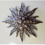 AN 18CT WHITE GOLD SUNBURST BROOCH Encrusted with diamonds. (4cm)