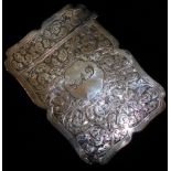 A VICTORIAN SILVER CALLING CARD CASE With scalloped edge and engraved with scrolled decoration,
