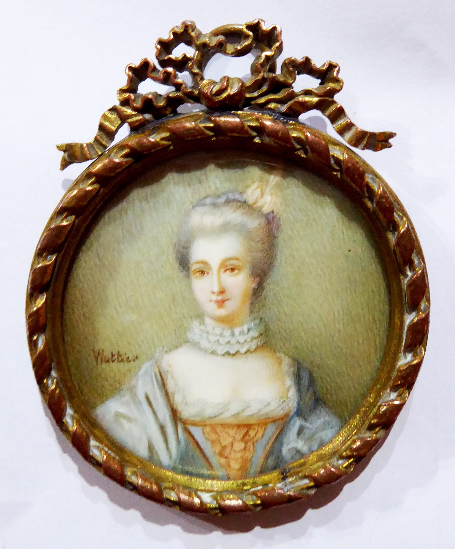 CHARLES EMILE WATTIER, FRENCH, 1800 - 1868, CIRCULAR PORTRAIT MINIATURE ON IVORY Maiden wearing a