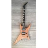 JACKSON, AN ELECTRIC GUITAR Having a naturalistic finish, a floating bridge and humbucker pickups,