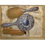 A 20TH CENTURY SILVER DRESSING TABLE VANITY SET Comprising a hand mirror, hair brush, clothes
