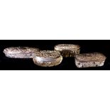 A COLLECTION OF FOUR SILVER AND CUT GLASS TRINKET BOXES Three oval and one rectangular, each
